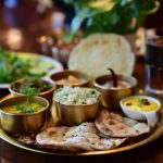 Untitled-1_0009_closeup-shot-indian-tasty-food-called-marwari-veg-thali-wooden-table